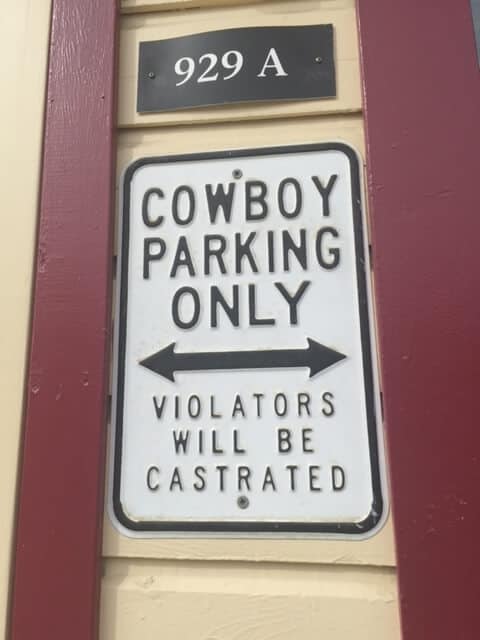 Metal novelty sign that says "Cowboy Parking Only"