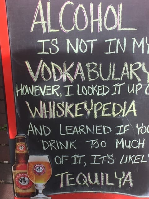 Humorous sidewalk sign