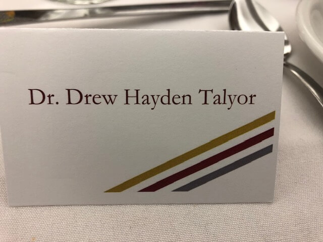 A table namecard for Dr. Drew Hayden Taylor misspelled as "Talyor"