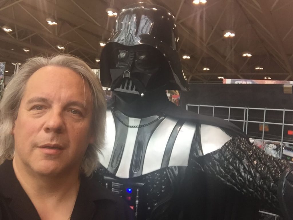 Drew takes a selfie with Darth Vader